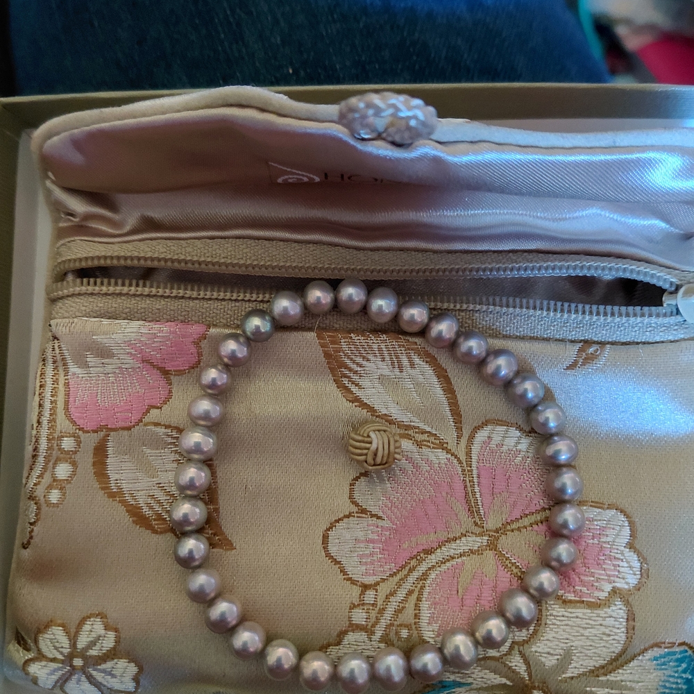 Elegant Floral Satin Clutch with Pearl Bracelet